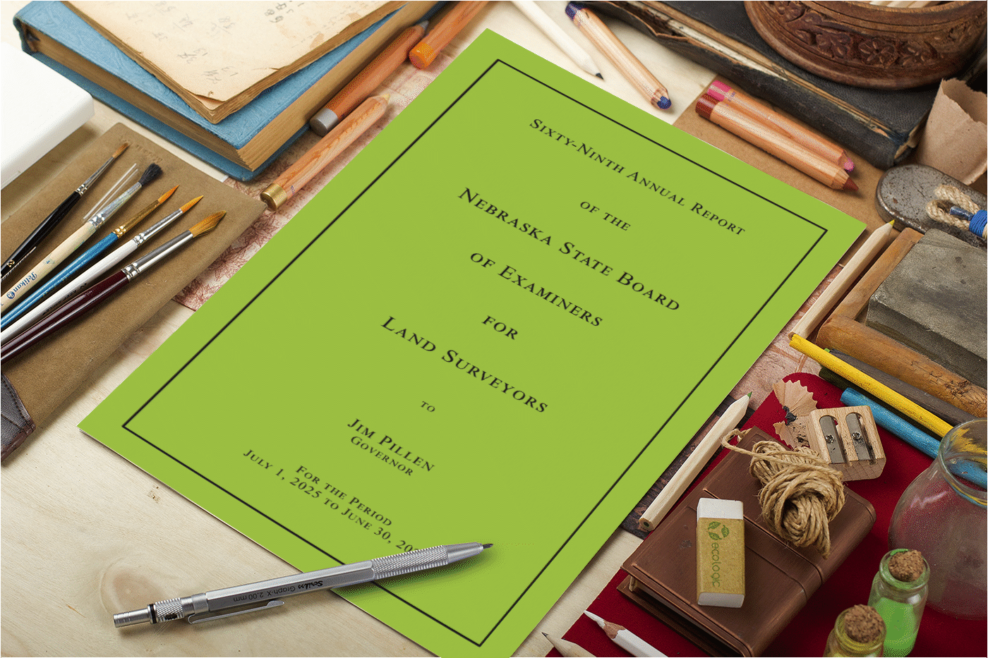 Book on a desk with pencils